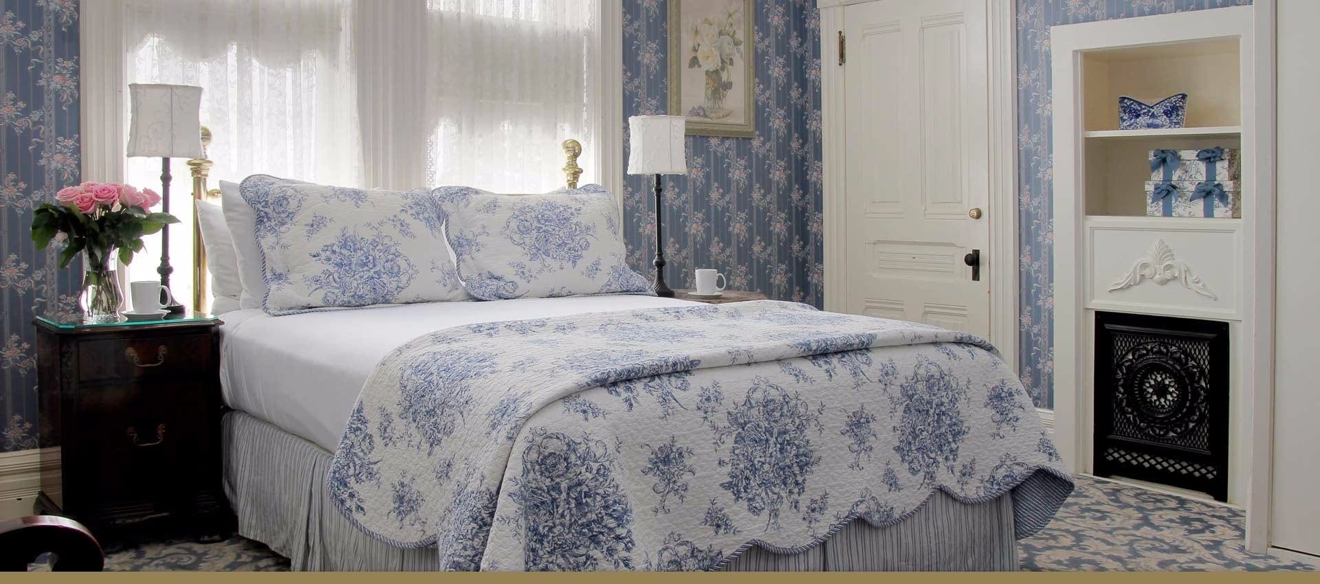 Victorian Inn B& Ellis Room bed and fireplace